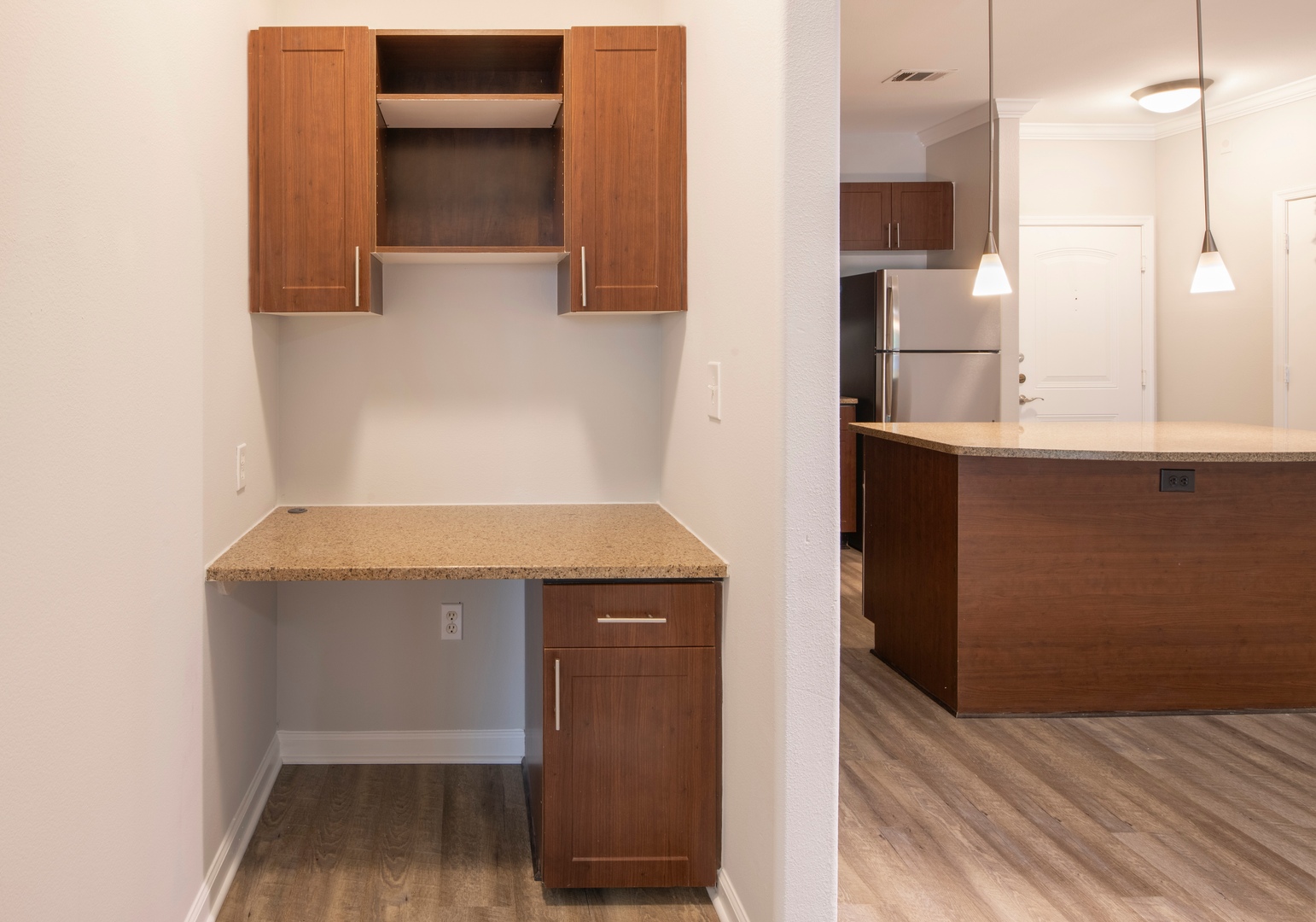 Built-in nook with cabinetry and workspace